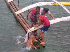 Kids swimming at Padre Burgos Pier