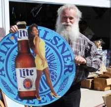 Phillip with sign at auction
