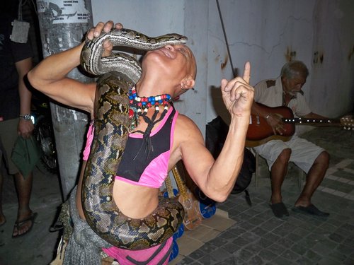 street performer with python in Cebu